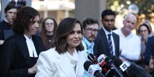 Lisa Wilkinson makes a short statement after emerging from court.