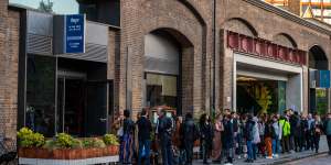 Diners queue outside Indian restaurant Dishoom at Granary Square in the King’s Cross district of London.
