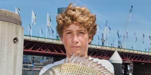 Taylor Rogers,15,fishing at Darling Harbour on Saturday.