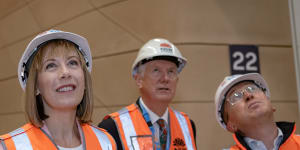 Transport Minister Jo Haylen (left) with Transport for NSW acting secretary Howard Collins and Sydney Metro chief executive Peter Regan on the underground concourse of Central Station.