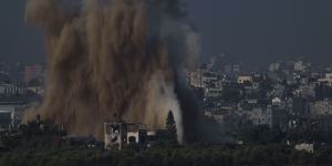 An Israeli airstrike in the Gaza Strip is seen from southern Israel on Friday.