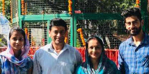 Australian permanent resident Pragya Chandel (second from left),his wife and two adult children were knocked back from the first repatriation flight out of Delhi after three of the four family members tested positive.