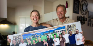 Terry and Jackie De Koning,the parents of young AFL stars Tom (Carlton) and Sam (Geelong) with a giant family photo including all 10 children.