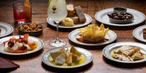 Snacks include the signature chicken liver parfait with potato chips (centre).