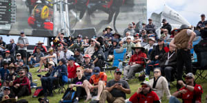 Spectators watch the qualifying and support races on the Friday before race day at the Bathurst 1000.