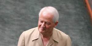 Liberal MP Philip Ruddock enters the chamber for question time in his safari suit in 2015.
