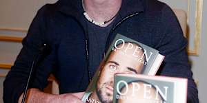 Andre Agassi with his memoir Open.