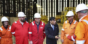 Conservative Party leader Rishi Sunak speaks with staff at the Global Energy Group facility at a campaign event at the Port of Nigg,Scotland.