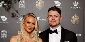 Lachie Neale,pictured with wife Julie,was in the thick of the counting action on Sunday night,and had the lead after round 11.