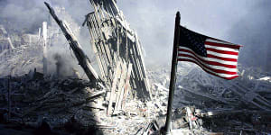 Am American flag flies near the base of the destroyed World Trade Center in New York,September 11,2001.