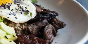 Breakfast,Muse-style:Brown rice with crisp beef tapa,sprouts,fried egg and chilli jam.
