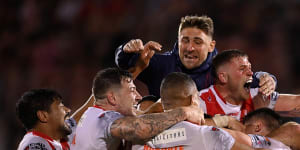 Jubilant St Helens players celebrate their dramatic win on Saturday night.