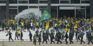 Supporters of Brazil’s former Brazilian president Jair Bolsonaro,storm the Supreme Court building in Brasilia,on January 8,in an attack bearing similarities to the riot at the US Capitol a year earlier.