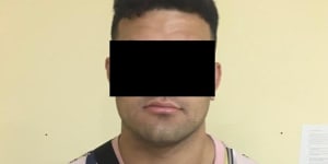 Rugby league player David Fifita in a blacked-out mugshot supplied by Kuta police.