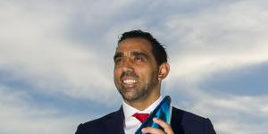 Off-field impact:Adam Goodes accepting his Australian of the Year award in 2014.