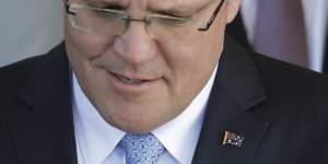 The Prime Minister gave all his ministers an Australian flag lapel pin.