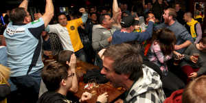 Socceroos fans rejoice at Cheers Bar in 2014 as Australia scores against Holland in the World Cup in Brazil.