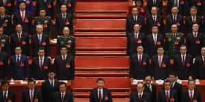 Chinese President Xi Jinping (centre) and his cadres sing the Communist song during the closing ceremony for the 19th Party Congress.