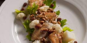 Confit chicken wings with cauliflower,sultanas and pinenuts.