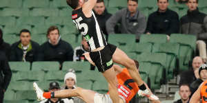 Jack Crisp flies high for the Magpies.