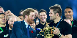 Prince Harry presents Richie McCaw with the Webb Ellis Cup after New Zealand’s 2015 Rugby World Cup final win over Australia at London’s Twickenham Stadium.