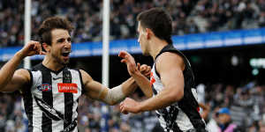 Josh (left) and Nick Daicos celebrate a goal against North Melbourne last year.