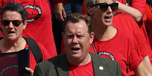 Teachers,principals and support workers throng the streets of Melbourne on Tuesday protesting pay,conditions and schools funding.