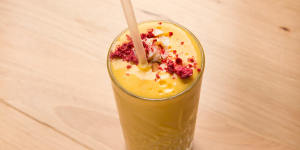 Mango smoothie with coconut yoghurt and milk,banana and turmeric.