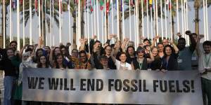 The COP28 final agreement did not achieve “the end of fossil fuels” as Greenpeace protesters,seen here,and others wanted.