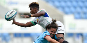 Ema Adivitaloga tackled by NSW’s Katrina Barker - but not without an offload.