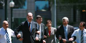 L-R:Tim Pallas,Richard Wynne,Daniel Andrews,Lisa Neville,Joe Helper and James Merlino link arms after joining the Labor frontbench in 2006.