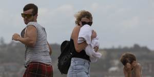 A gale-force southerly buster ambushes beach goers at Bondi.