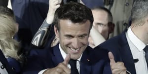 French President Emmanuel Macron thumbs up after reports of his re-election.