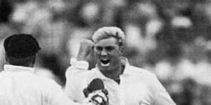 Australian bowler Shane Warne (C) and keeper Ian Healy celebrate after Mike Gatting was clean bowled by Warne with his first ball on the second day of the first Test,June 4,1993.