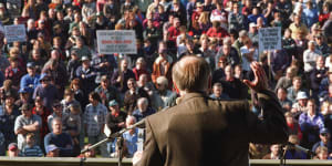 John Howard wears a bullet proof vest under his jacket as he addresses a gun control rally in Sale shortly after becoming prime minister. 