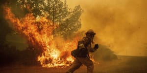 'The new abnormal':California fires rage as dry winds menace