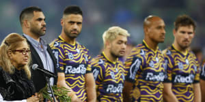 Aunty Joy Murphy performs a Welcome to Country before the round 12 game in 2022 as Storm players line up in their Indigenous jumpers for Indigenous Round. 