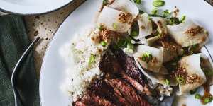 Marinated minute steaks with sesame daikon salad and steamed rice.