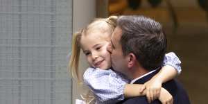 Treasurer Dr Jim Chalmers with his daughter after delivering the budget speech.