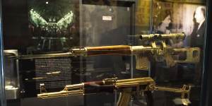A gold AK-47 that belonged to Saddam Hussein along with an Iraqi sniper rifle is on display at the Central Intelligence Agency headquarters building’s refurbished museum.