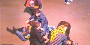 Lidia Thorpe,wearing black boots and a Richmond guernsey,is pictured on the ground outside the MCG.