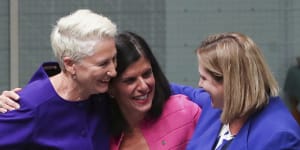 Crossbench MPs Kerryn Phelps,Julia Banks and Rebekha Sharkie celebrate after the bill passes the House of Representatives.
