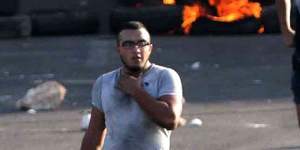 Lebanese protesters set fire to tires in Jiyeh,southern Lebanon,to block the highway and make a point about garbage.