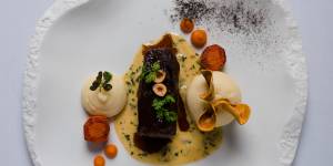 The angus beef cheek,pomme puree,slow-baked celeriac,hazelnuts,oyster leaf and cafe de paris sauce at Courgette.