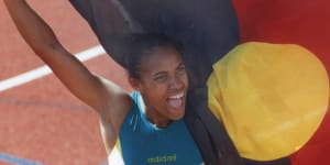 Cathy Freeman with Indigenous flag in Victoria.