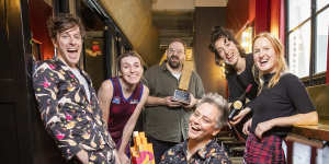Geraldine Hickey (middle) with her 2021 Melbourne International Comedy Festival Award,with fellow winners (from left) Charlie Zangle,Melanie Bracewell,Greg Larsen,Nat Harris and Hannah Camilleri. 
