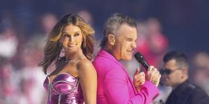 Robbie Williams with Delta Goodrem at the grand final.