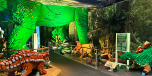 The baby dinosaur enclosure has a Brachiosaurus that is incorporated into the roof and walls of the exhibit.