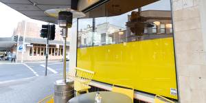 ‘Storm in a teacup’:Cafe ordered to remove yellow signage because it needed council permission