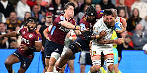 Josh Lord of the Chiefs attempts to break away at Suncorp Stadium.